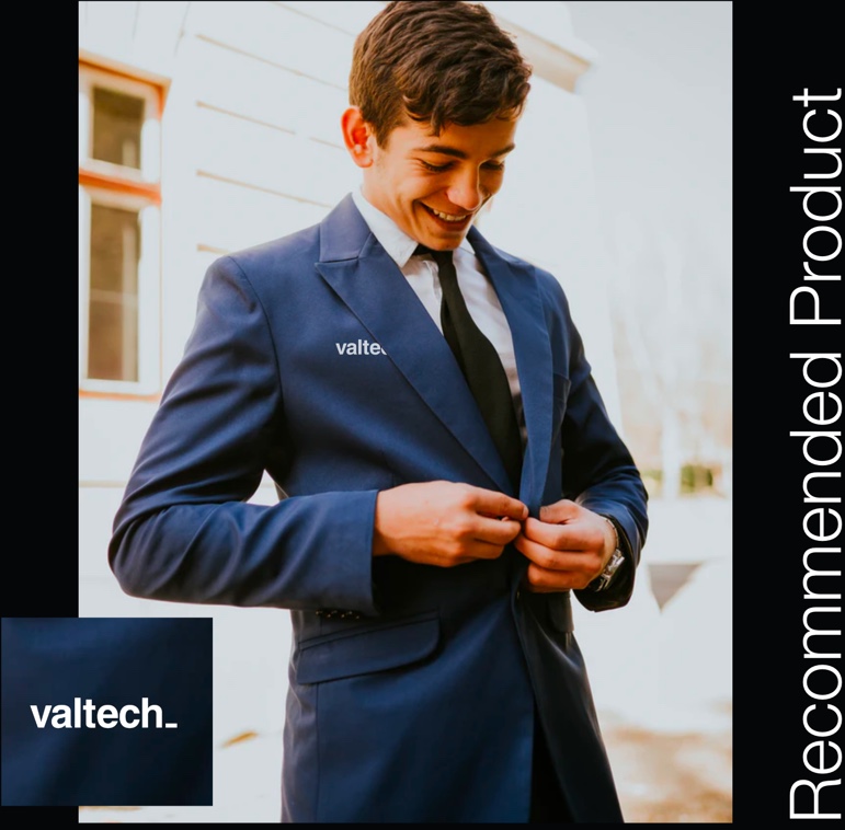 Recommended Product: A young man buttons a navy blue blazer with valtech_ logo on pocket.